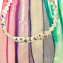 Load image into Gallery viewer, ANGELIC Sparkle Bracelet. A Swarovski Crystal beaded bracelet with the word &quot;ANGELIC&quot; written on it, with white beads and black writing. 