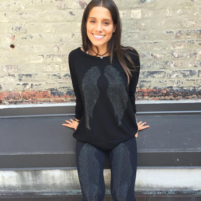 ANGELIC NYC black crewneck with black wings.