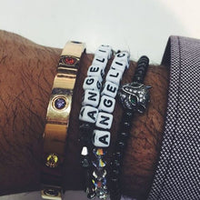 Load image into Gallery viewer, ANGELIC NYC bracelets on the wrist of mogul Evan Luthra. 