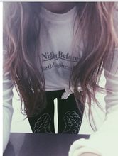 Load image into Gallery viewer, Girl wearing legwings. Black leggings with black and silver wings on each leg. 